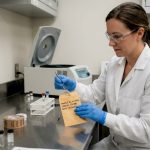 Lab technician places hair sample in envelope