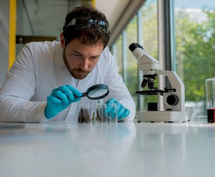 Lab technician examining hair drug test samples