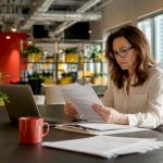 Woman reviewing drug testing policy documents