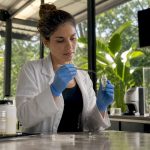 Forensic technician preparing bleach for hair analysis