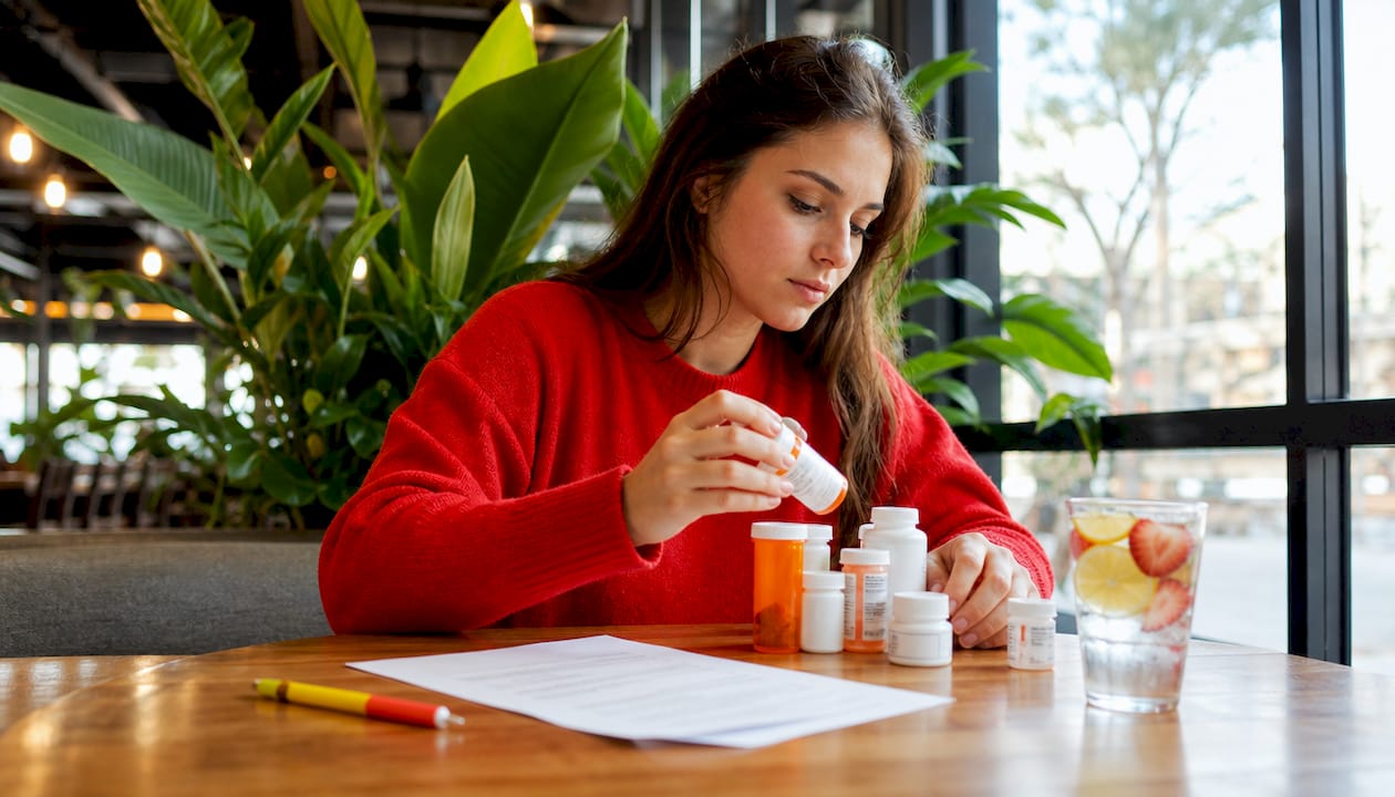 Person organizing medications before hair drug test