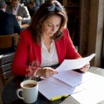 Woman reviewing drug testing regulations documents