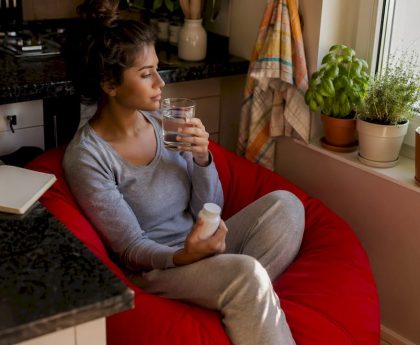 Woman managing detox side effects at home