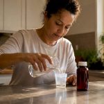 Person preparing urine sample for drug test