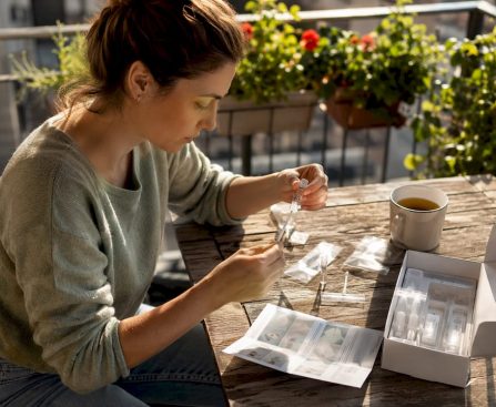 Woman assembling home hair drug test kit at table