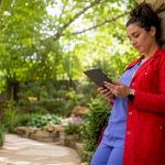 Nurse monitoring detox timeline in hospital ward
