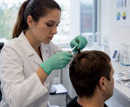Lab technician collecting hair sample for testing