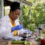 Scientist preparing detox drink formula in lab