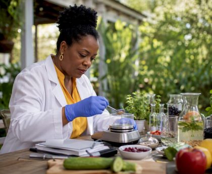 Scientist preparing detox drink formula in lab