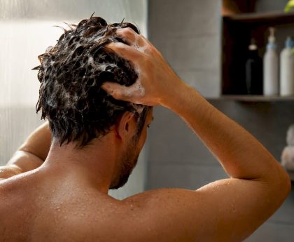 Applying detox shampoo to hair roots