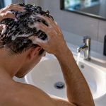 Hands washing hair during a cleansing session