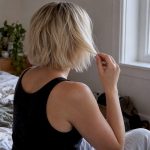 Woman resting freshly bleached hair before washing