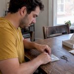 Person sealing a home hair sample kit