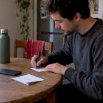 Person noting detox kit timing at home